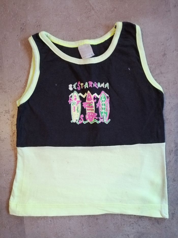 Débardeur noir et jaune 2/4 ans