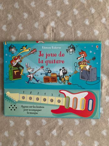 Je joue de la guitare