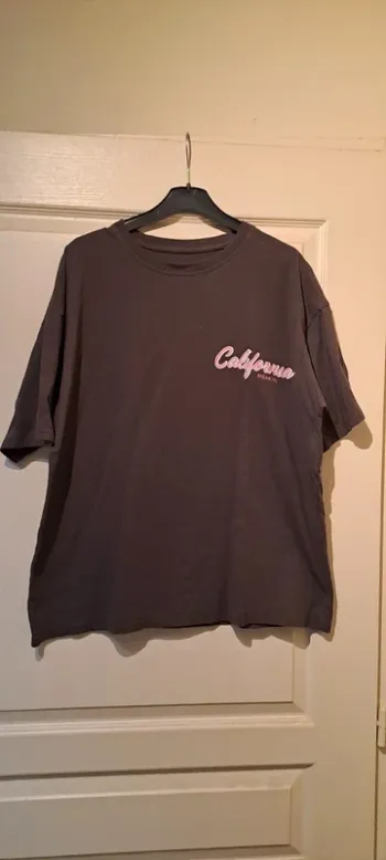 T Shirt marron/kaki California Dreaming - Marque Shein - Taille 36 - Très bon état.