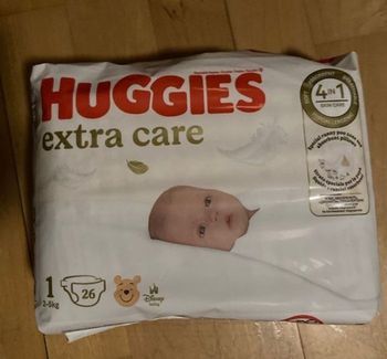 Couches huggies  extra care T1 neuf + 1/2 paquet