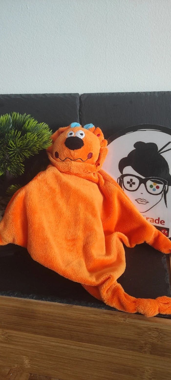 Doudou lion orange pois ronds rouge bleu vert jaune Carréblanc Carré Blanc