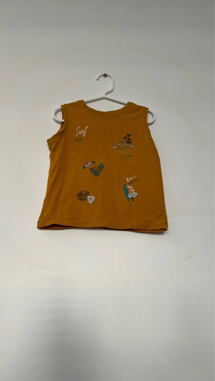 T shirts sans manche in extenso en parfait état taille 4 ans . - photo numéro 3