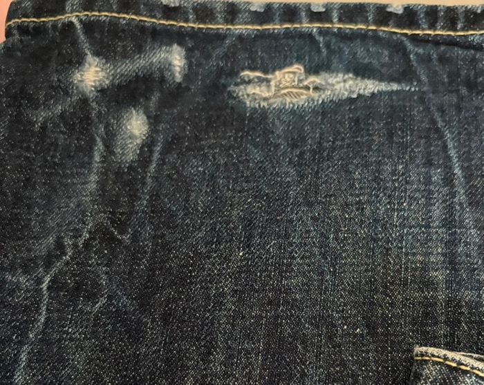 Jeans bleu troué - photo numéro 3