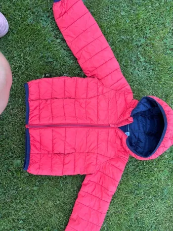 Manteau  Okaidi  6 ans  Un petit accro sur une manche