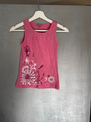 Débardeur rose avec motif fleuri blanc taille 8 ans 