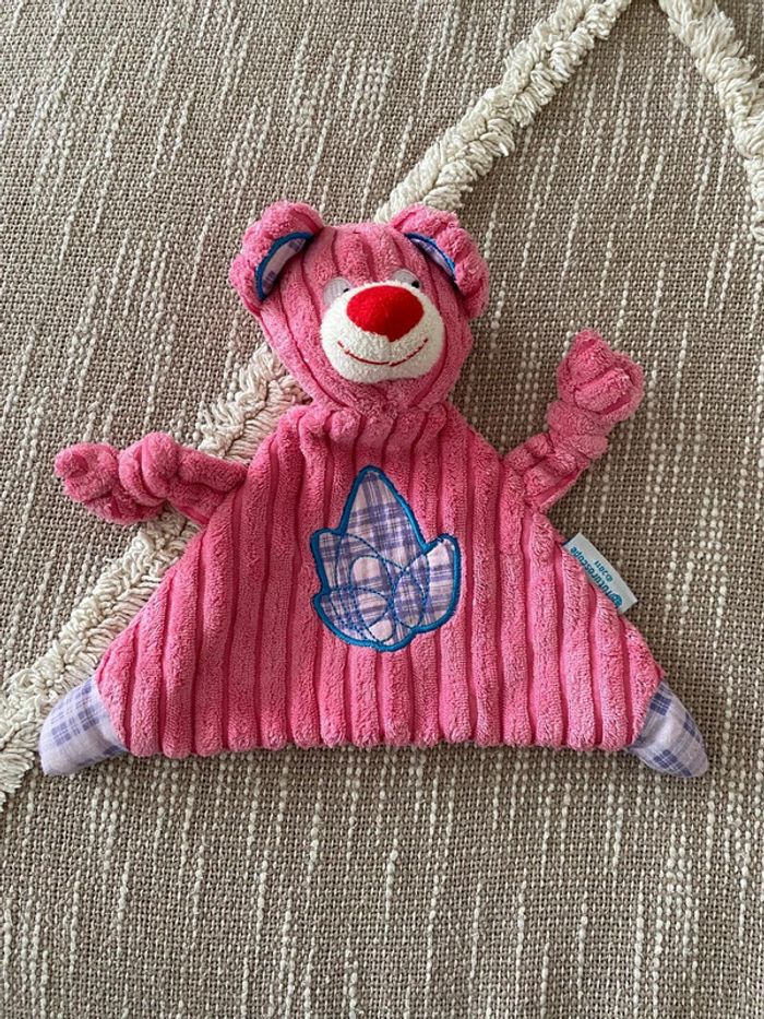 Peluche doudou plat 20cm Futuroscope 2011 ours côtelé rose très bon état