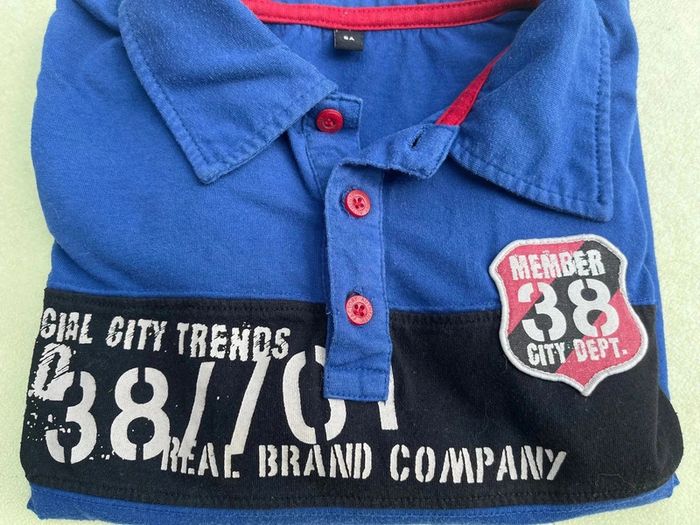 Polo bleu avec manche longue cousu noir taille 8 ans - photo numéro 4