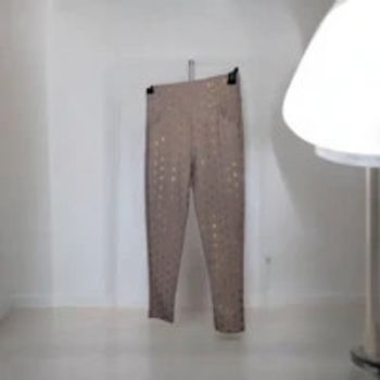 Legging rose à motifs dorés scintillants