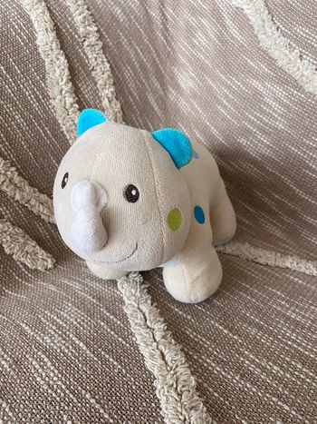 Peluche doudou 25cm sucre d’orge rhinocéros beige et bleu à pois très bon état