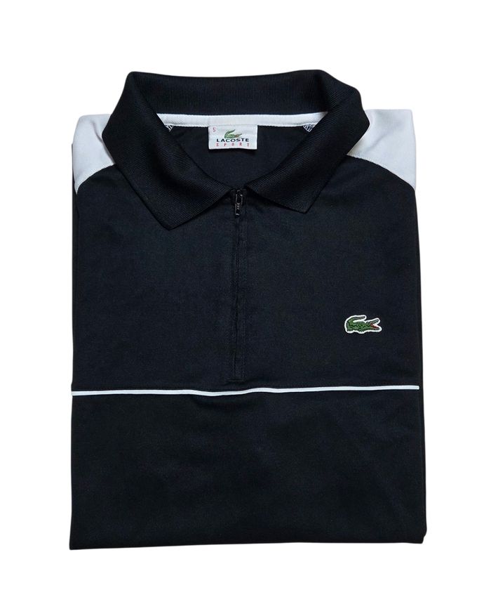 Polo Lacoste taille 5 / L noir et blanc Très bon état