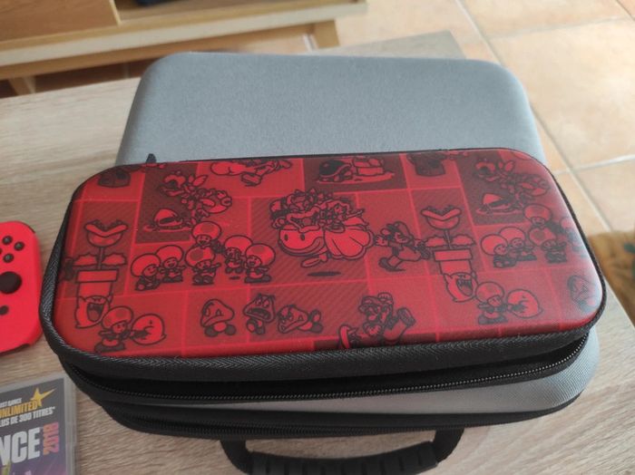Nintendo Switch avec jeux et pochettes - photo numéro 9