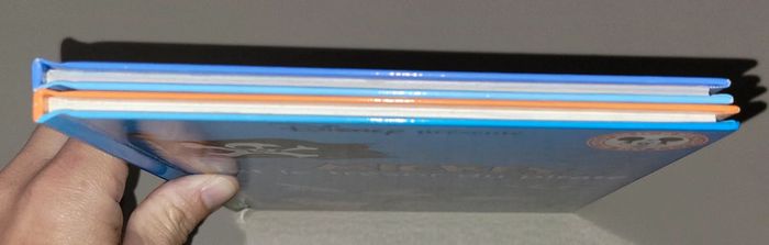 Lot de 2 livres disney mickey et le trésor du pirate eh bienvenue chez les robinson - photo numéro 4