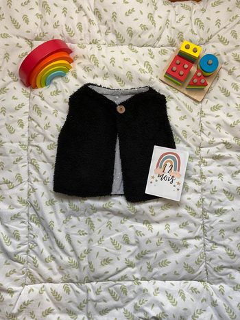gilet sans manches en fourrure noir intérieur gris étoilé 12 mois