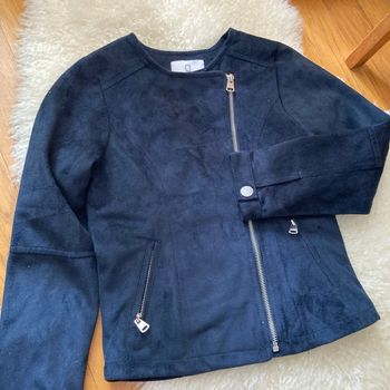 Veste Okaïdi, huit ans