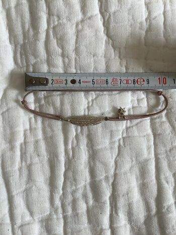 Bracelet lien ajustable avec plume métal argenté