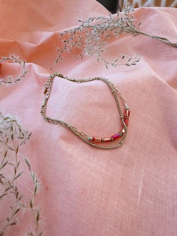 Bracelet or acier inoxydable et pierre cristal fushia neuf