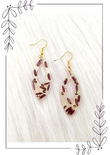 Boucles d'oreilles ovales en résine avec grains de riz