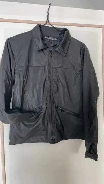 Veste noire enduite