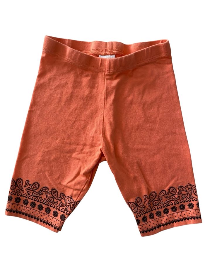 Legging court orange Palomino – Taille 104 – Motif noir bas de jambe