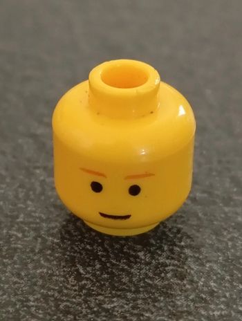 Minifigure,head mâle brown eyebrows,slight smile pattern.