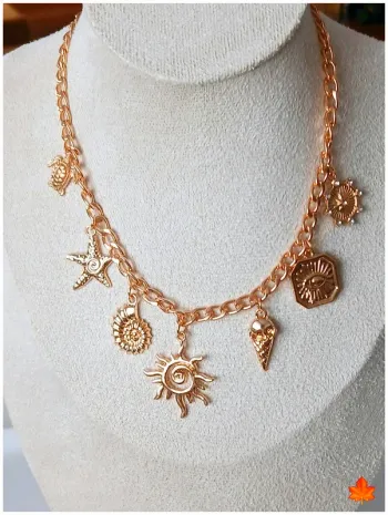 Collier doré breloques soleil, étoiles & coquillage – tendance bohème
