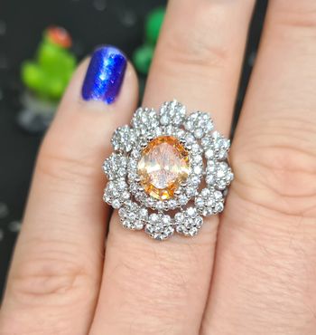 Bague fantaisie argentée avec zirconiums et pierre champagne