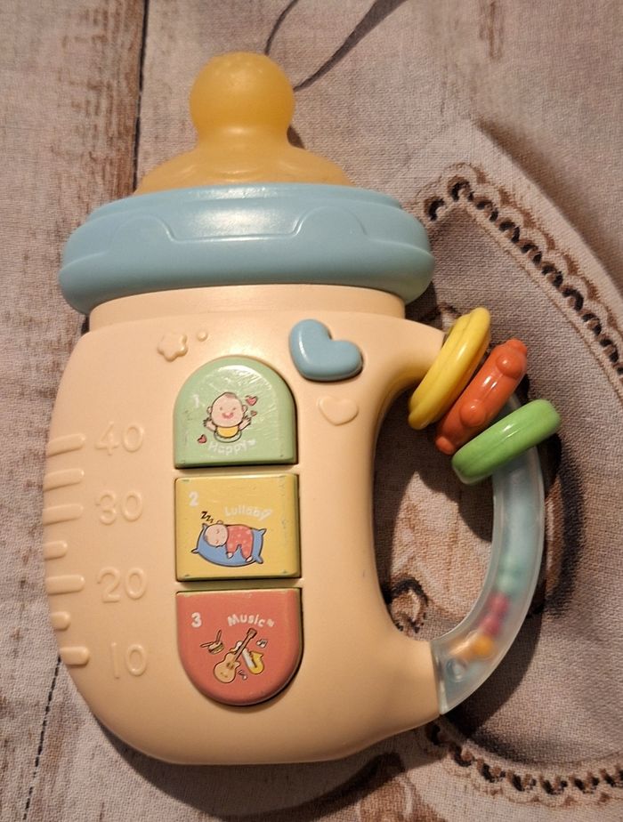 Biberon hochet sonore et lumineux
