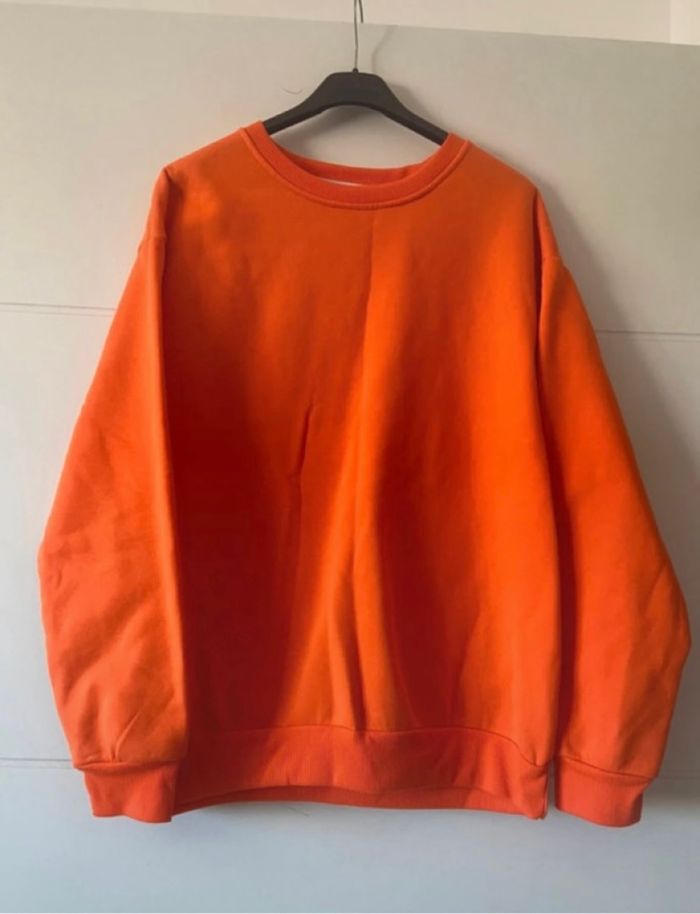 Pull orange taille L