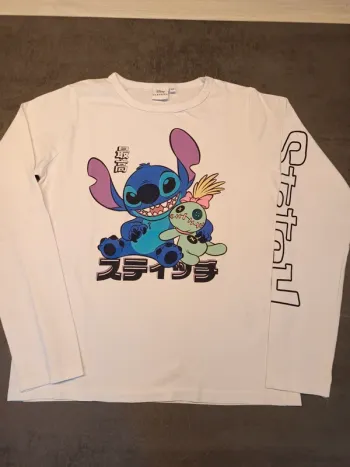 Vends tee-shirt manches longues mi saison Disney Stitch taille 12 ans .