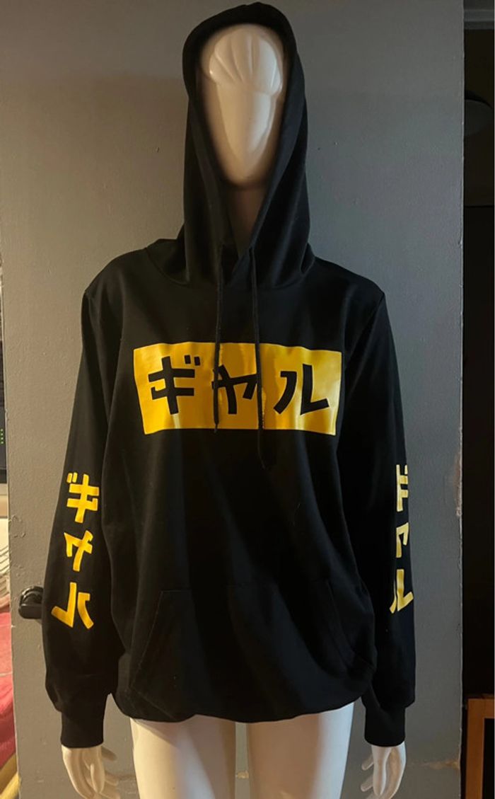 Pull capuche logo chinois en M