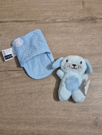 Peluche chien dans sac de couchage