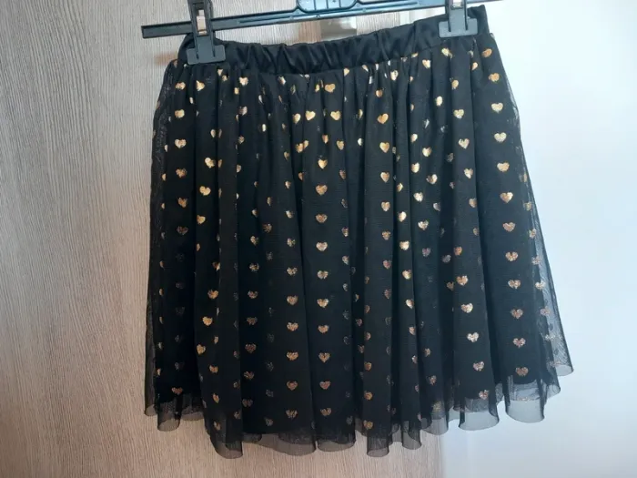 Jolie jupe noire à motifs cœur dorés 9-10ans