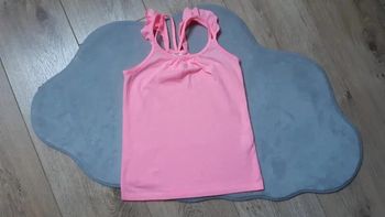 Débardeur tape à l'oeil rose fluo 6 ans en très bon état