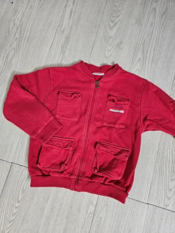 Gilet / veste zippé.e à poches