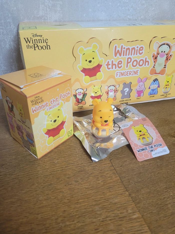 Figurine winnie sur doigt herocross