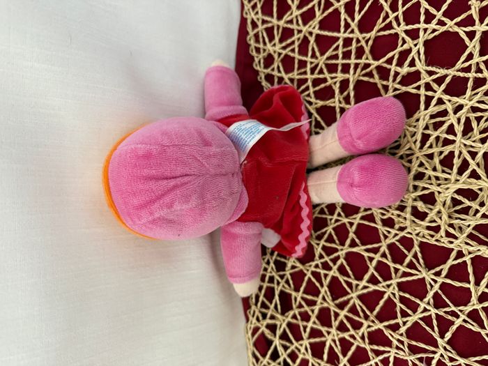 DOUDOU POUPEE COROLLE robe rouge rose capuche bord orange 25cm fleur - photo numéro 2