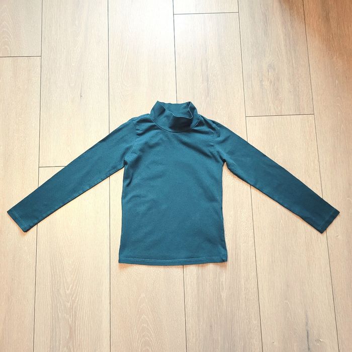 Maillot manche longue à col haut, bleu tres légèrement pailleté. Fille 6 ans. Marque Du pareil au même