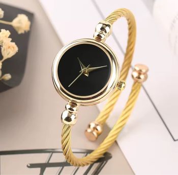 Montre bracelet doré & cadran noir – Chic et intemporelle