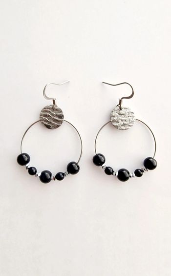 Boucle d'oreille créole noir et argenté