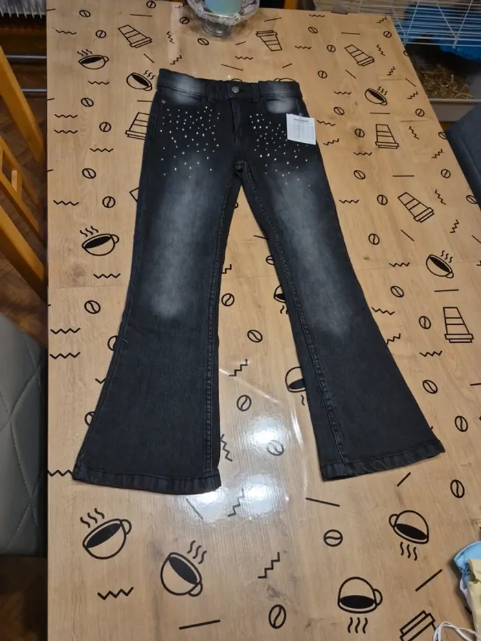 Jeans patte d éléphant a strass 11/12ans