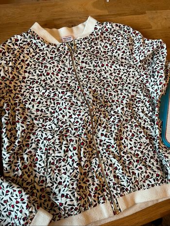 Bombers fleuri tape à l’œil taille 10 ans tbe