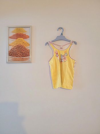 Top minnie jaune "DISNEY " comme neuf taille 2 ans