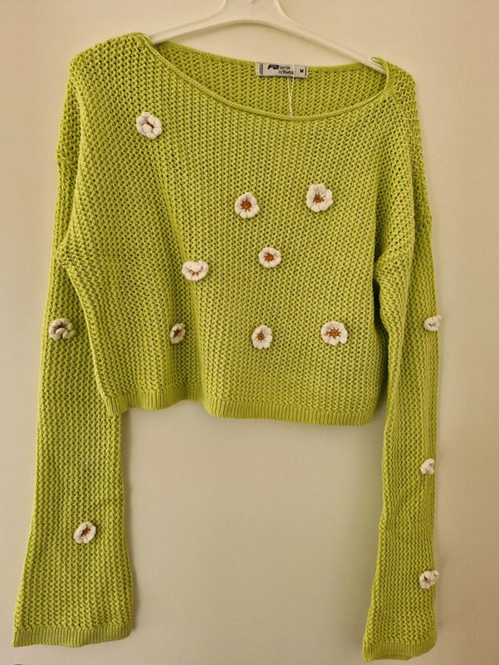 Pull court taille M.