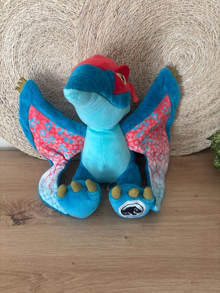 Doudou dinosaure bleu rouge ptéranodon jurassic world
