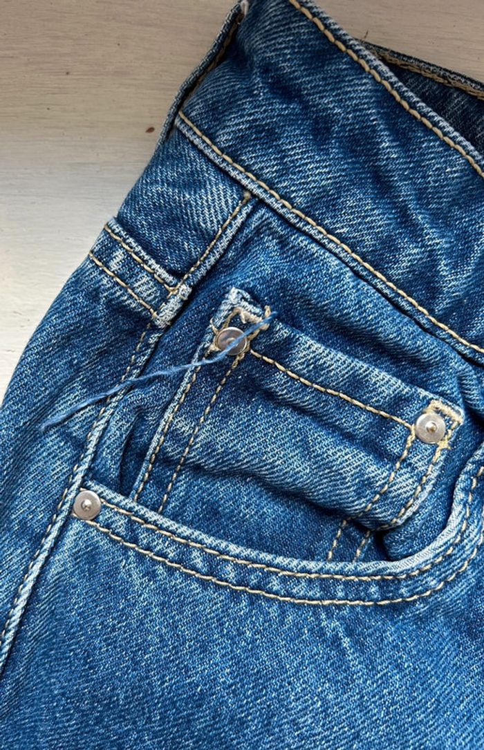 482 - jeans bleu foncé avec braguette à boutons et retaillé - photo numéro 6