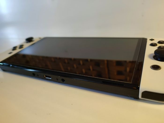 Console Nintendo Switch OLED Blanc 64Go + 2 Jeux + Sacoche + Carte Micro SD - photo numéro 3