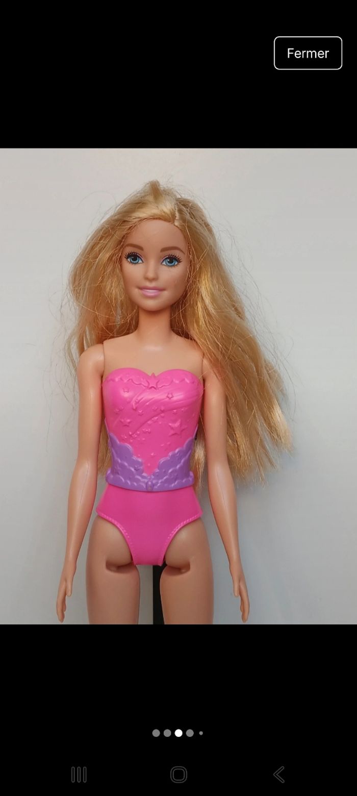 Poupée mattel barbie maillot fushia et mauve tête 2013 corp 2017 
Poupée et ensemble compris - photo numéro 2