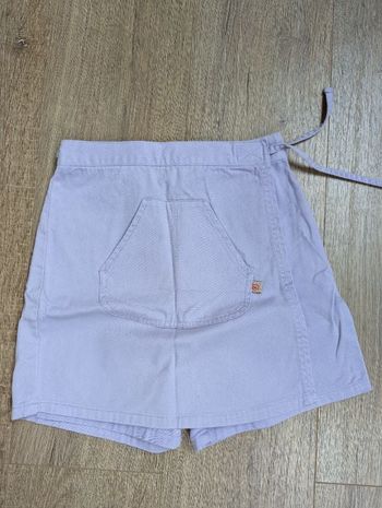 Jupe-short violette. T. 10 ans