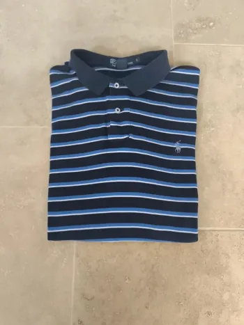 Polo marine a rayures bleues et blanches L logo bleu excellent état sauf trous