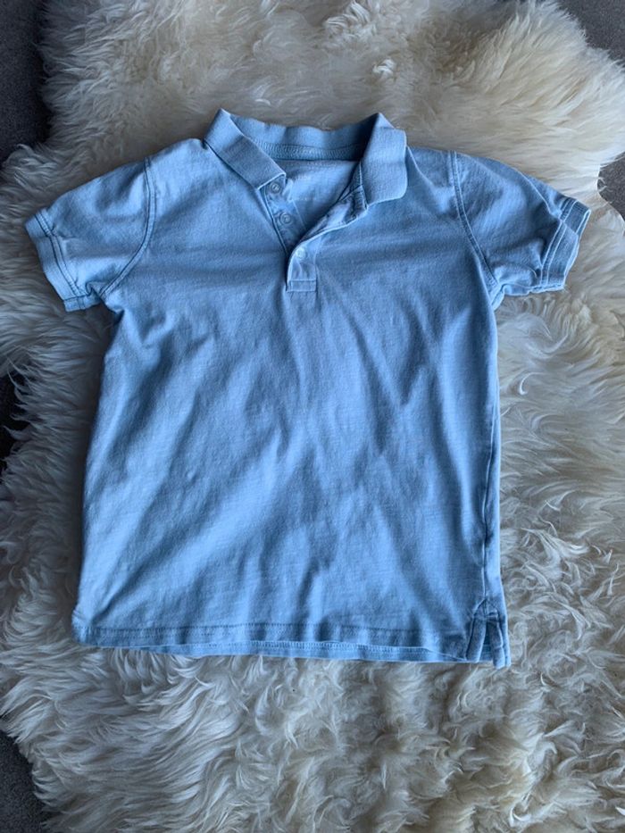 Polo bleu ciel 6/7 ans